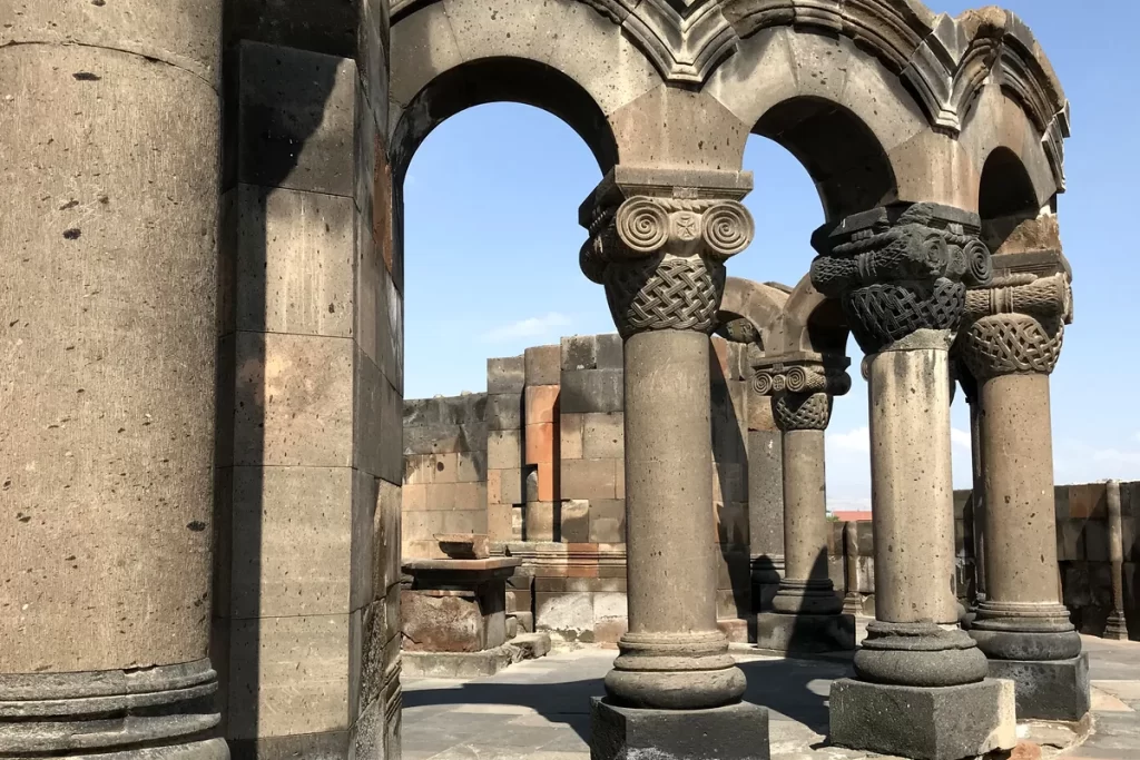 Carved columns and arches at the ruins of Zvartnots Cathedral in Armenia